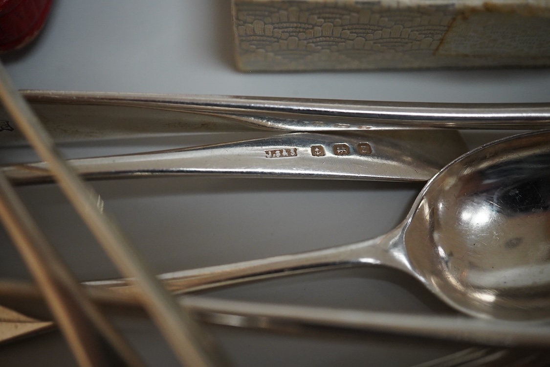 A cased set of five(ex 6) silver teaspoons and pair of sugar tongs, a set of six shell end coffee spoons, five other silver items of flatware, a boxed set of six 830 standard white metal teaspoons, an 800 standard shovel